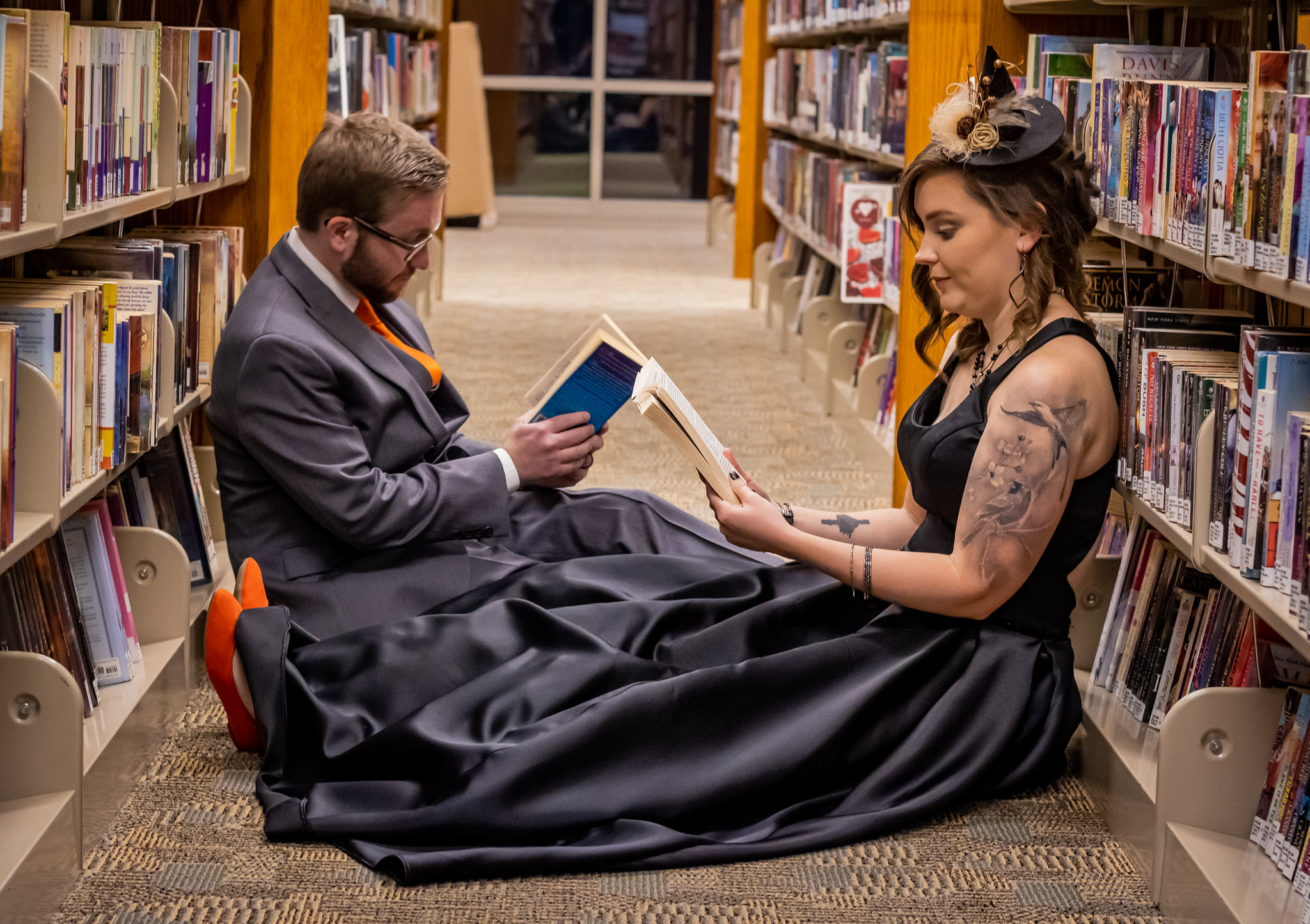 Ben and Caele reading in the stacks